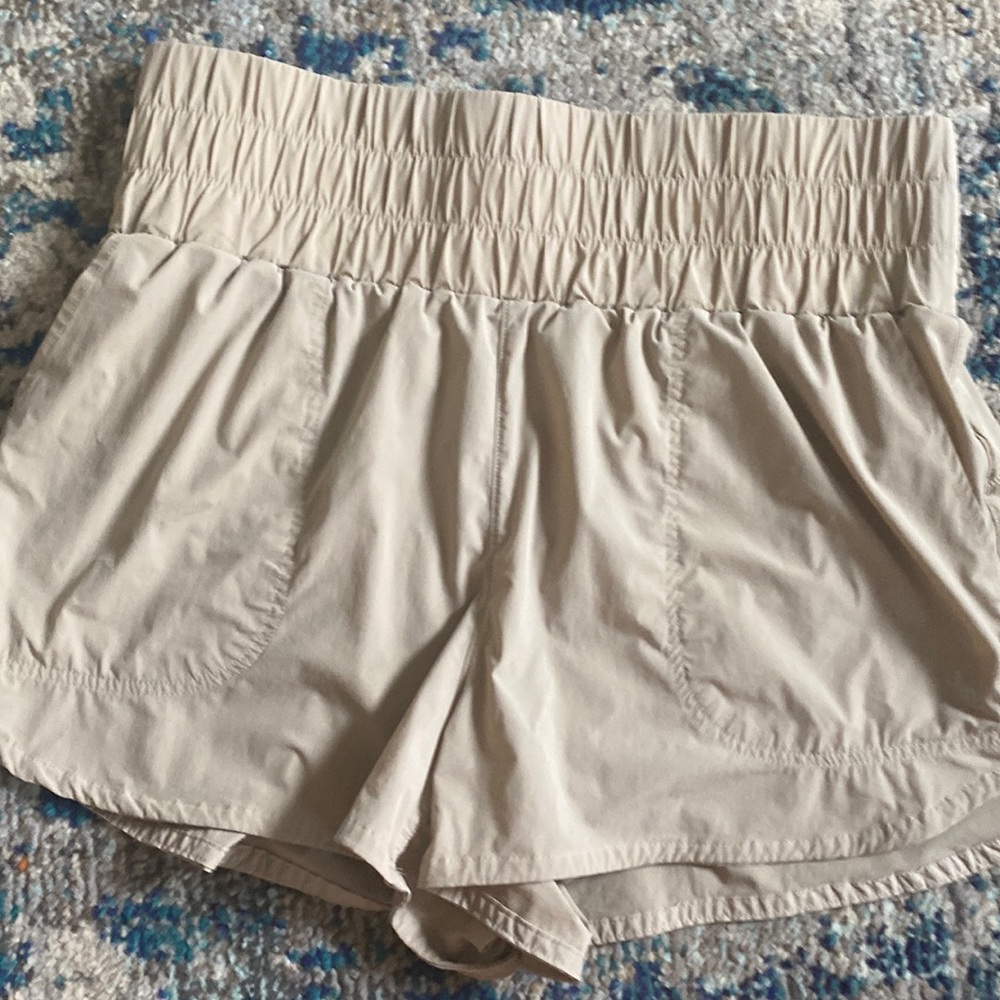 JoyLab athletic shorts. Built in panties. Pockets.Tan. Like new condition.